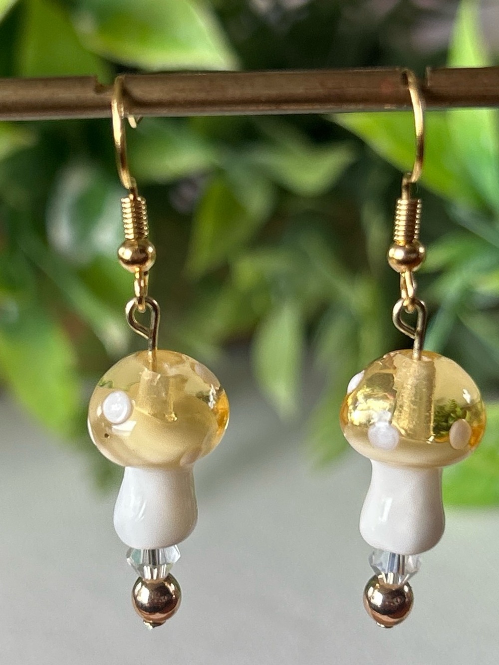 Handmade yellow mushroom + hematite drop earrings in gold